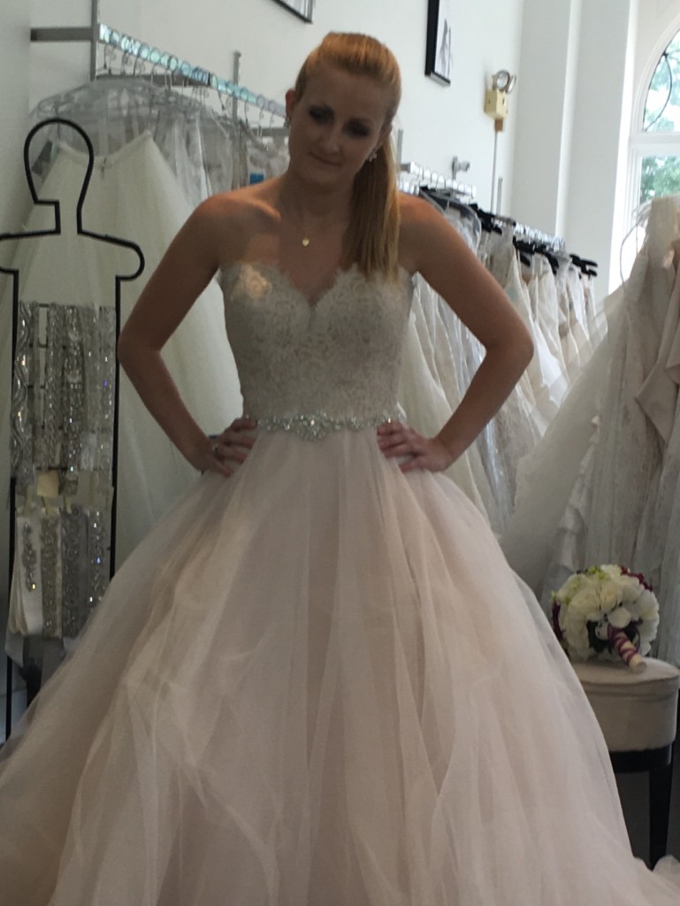 Maggie trying on wedding dresses